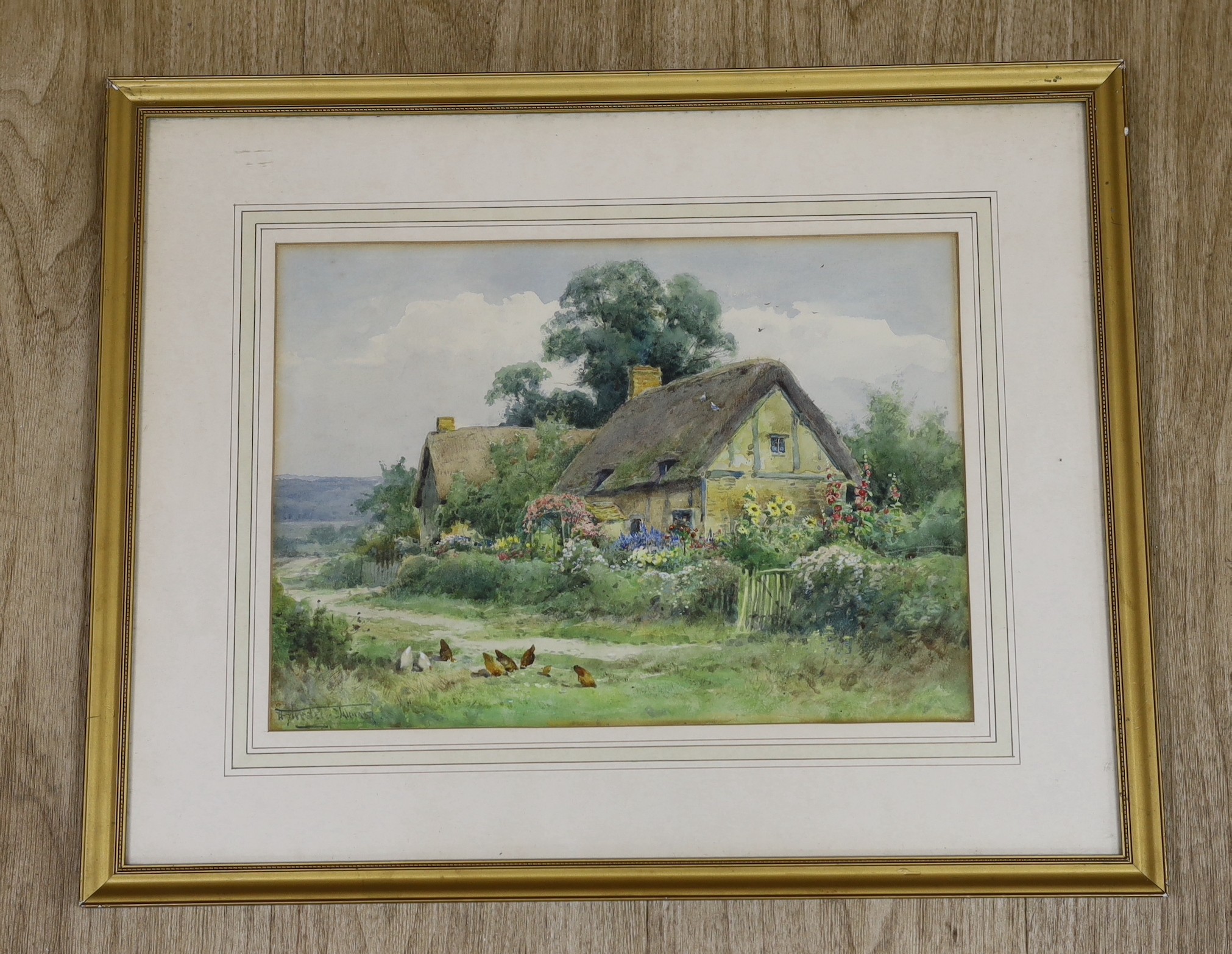 Henry John Sylvester Stannard (1870-1951), watercolour, Chickens beside a thatched cottage, signed, 24 x 34cm